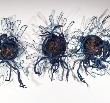 Changing Phases. Cheesecloth, dye, wire, newspaper and acrylic. 2017