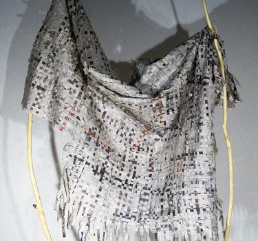 Cloth II. Newspapers and sticks. 96"x72"x12". 2003