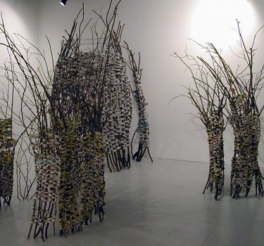 Fenced Spaces. Newspapers, Yellow Pages and wood. 2004