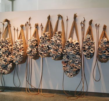 Slings. Newspaper, burlap, and rope. 2006