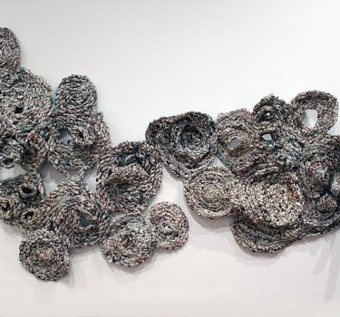 Topography. Newspapers and strings. 2010