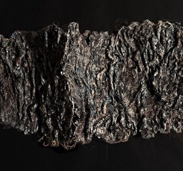 Traces of Memories. Handmade paper, dye, acrylic, rope, ground coffee and burlap. 43"x26"x8". 2009